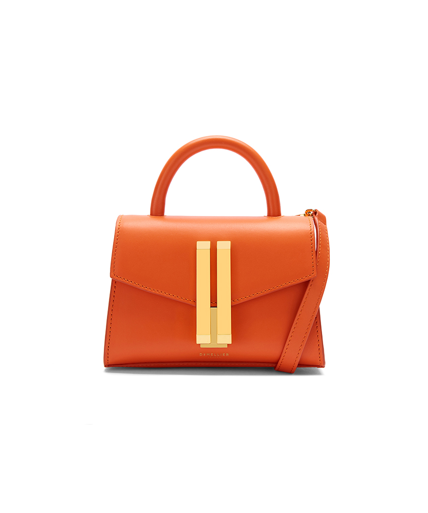 Orange Demellier Bag with gold buckle on white background