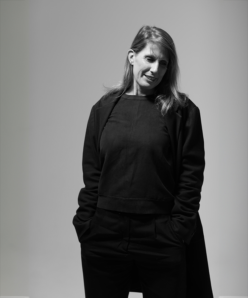 Jodi Hinds stood against Grey background at SHED london photography studio and desk space