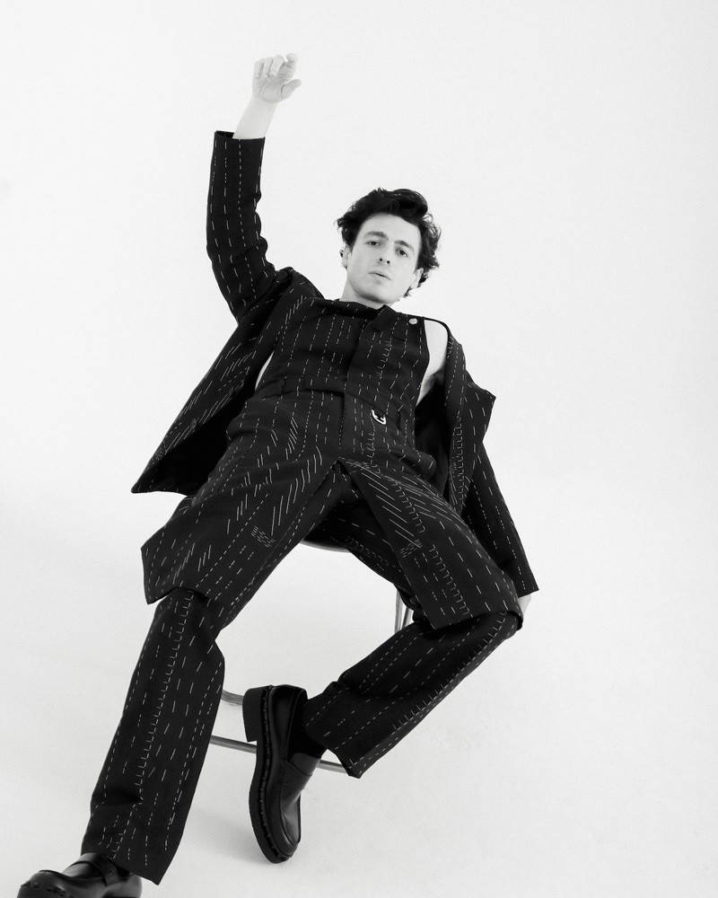 Anthony Boyle sat on a white box in a photography studio east london